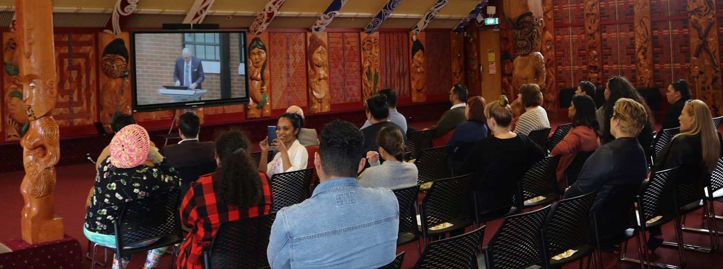 Manakau Institute people sitting facing digital presentation